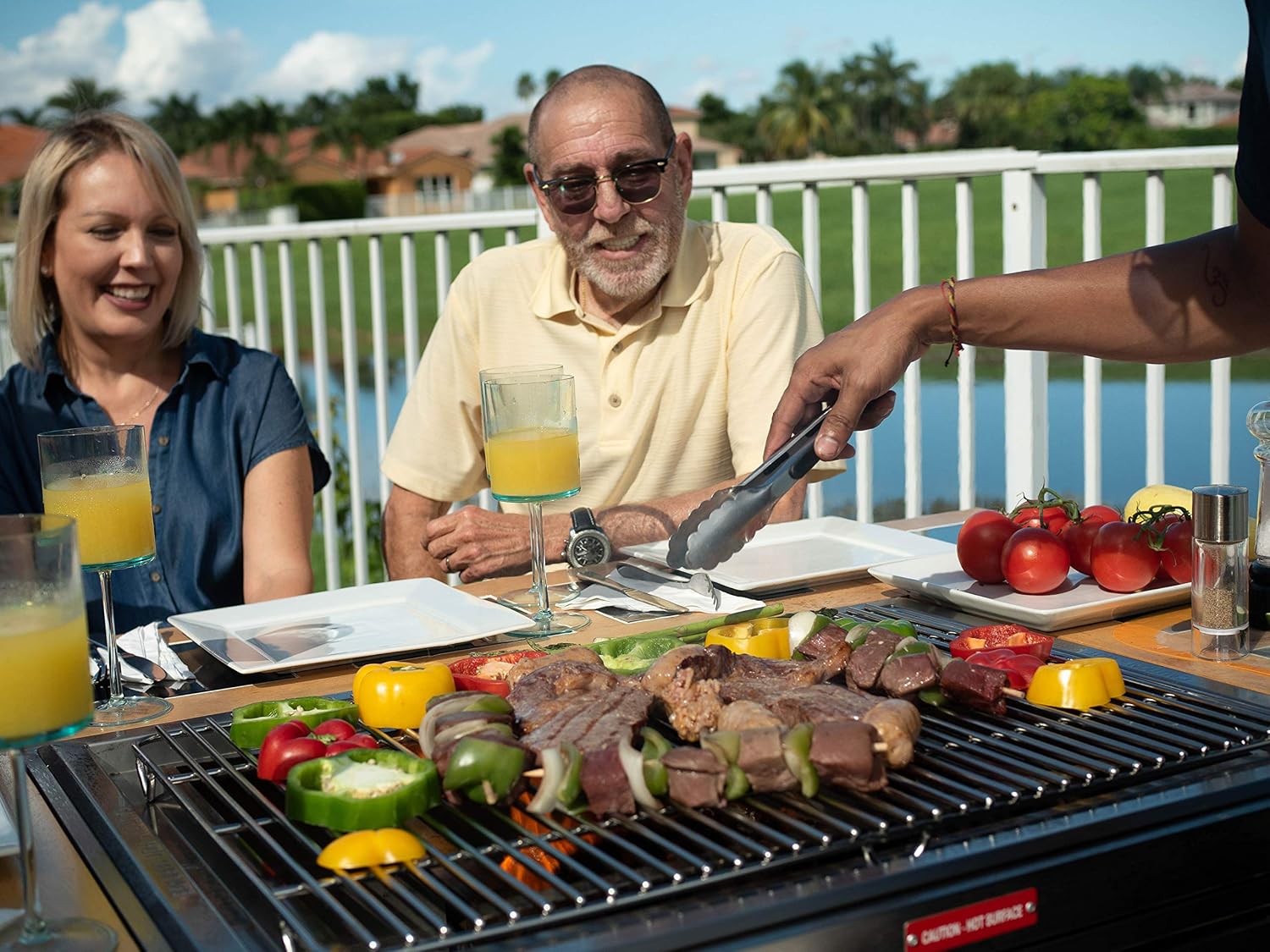 3-in-1 Sit Around Grill with Flat Top Teppanyaki Griddle, BBQ Rack and Cast Iron Grill - Propane Gas and Stainless Steel - Perfect for Outdoor Cooking and Portable for Tailgating, HBC1B